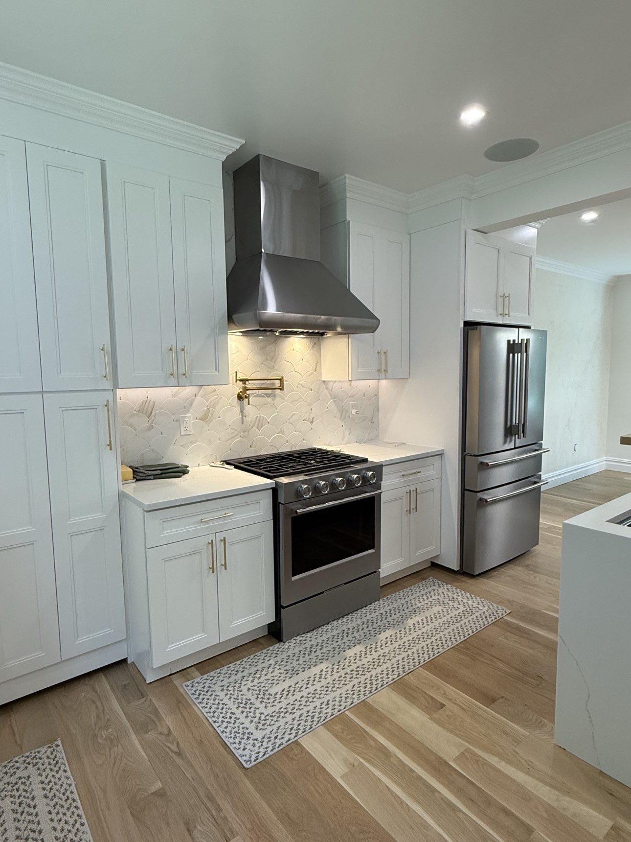 Finished kitchen with island and custom cabinetry